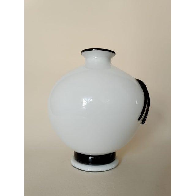 Milky white Murano vase with decoration, vase designed as a tribute to the painting Tagli by Lucio Fontana. This piece is...