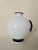 Milky white Murano vase with decoration, vase designed as a tribute to the painting Tagli by Lucio Fontana. This piece is...