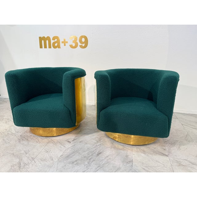 This pair of Italian armchairs, upholstered in deep turquoise bouclé, offers a lush and tactile experience. The curved...