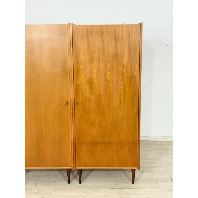 Very beautiful vintage wardrobe in a stylish mid-century design. The wardrobe is in good, well-maintained condition and...