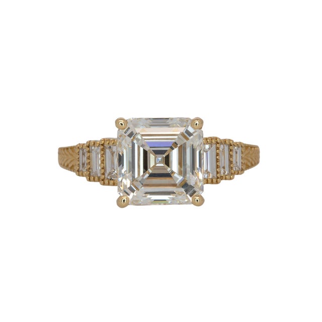 This stunning Asscher cut ring features a brilliant 3Ct 8mm lab-grown diamond accented by sparkling side stones for...