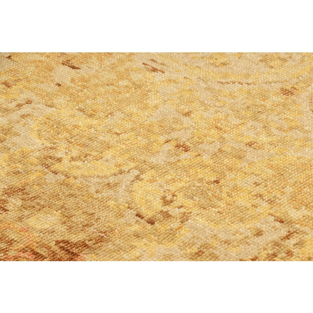 Hand-knotted in wool, this 3x4 modern European rug, originating from India, as inspired by grand European designs of...