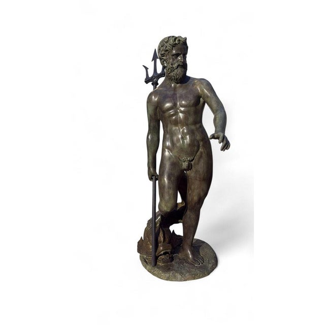 Monumental bronze statue of the god Neptune with patinated finish. Created in the 1970s, this piece is in good condition....