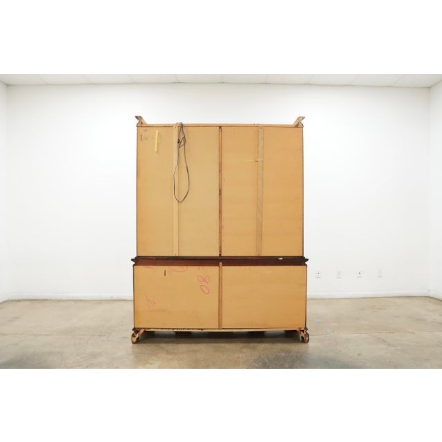 This vintage display cabinet by Universal Furniture blends classic craftsmanship with distinctive Asian-inspired design...
