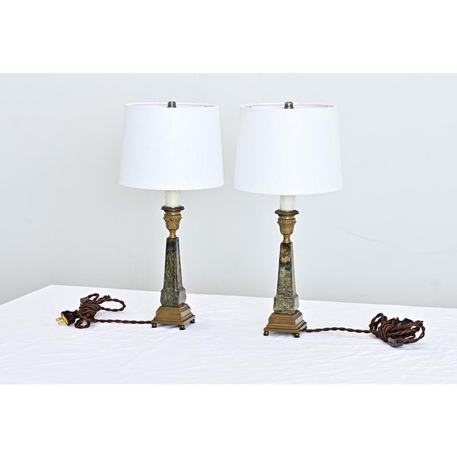 French vintage Grand Tour inspired marble table lamps, these diminutive stone obelisks are illuminated by medium-base...