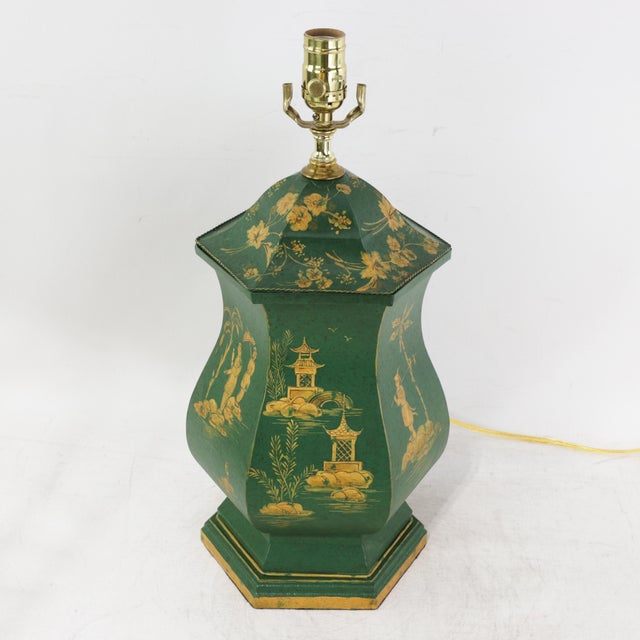 This sophisticated vintage hand-painted tole table lamp features a distinctive scalloped hexagon silhouette finished in a...