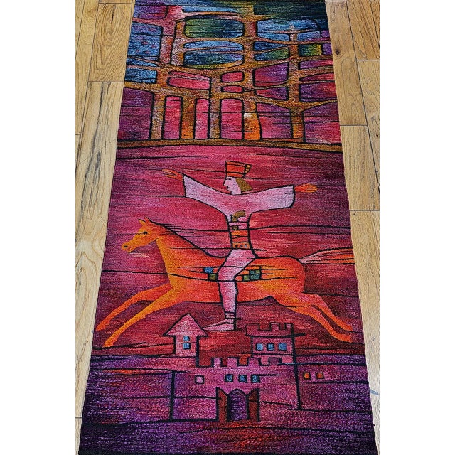 This stunning vintage mid-century handwoven tapestry captures the dynamic energy of a folkloric rider performing...