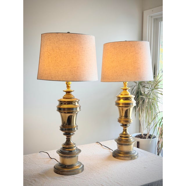 Vintage Pair of Stiffel Solid Brass Hollywood Regency Urn Table Lamps with Linen Shades Description Exceptional vintage...