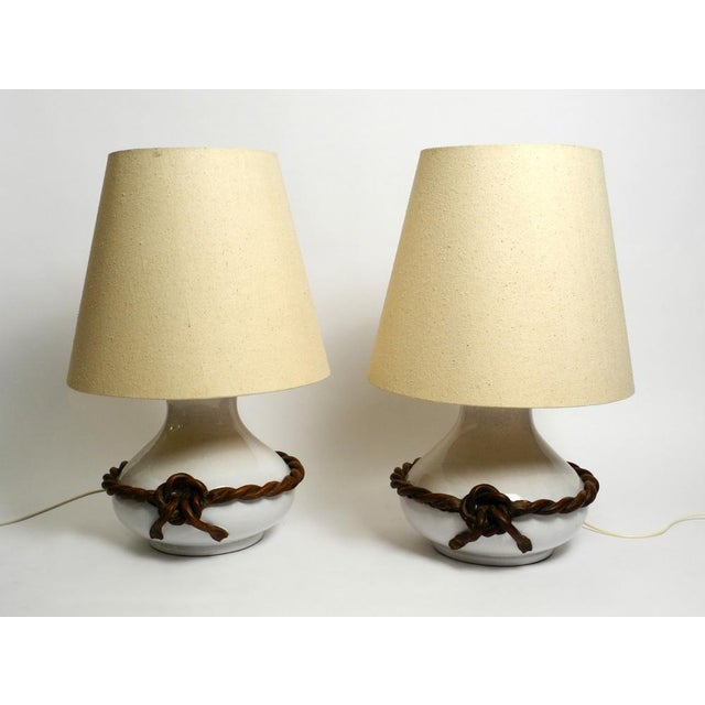 Two beautiful giant Italian Mid Century white ceramic table lamps with original shades. Great classic Italian design....