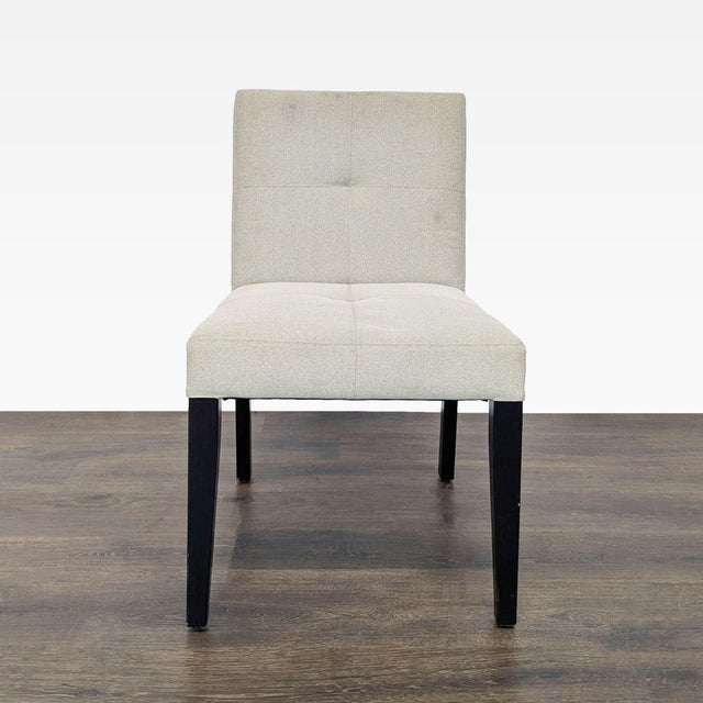 Low back chairs on wood legs. Brand: Crate & Barrel. Dimensions (in): 20W x 20D x 34H.