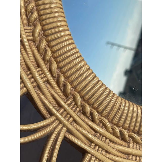 Vintage faux rattan oval wall mirror made by MGM is 19” wide by 30” tall. This stunning lightweight mirror is an eye...