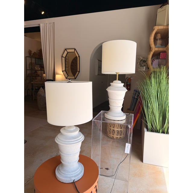 Elevate your space with this contemporary transitional table lamp featuring a sculpted white marble base with subtle...