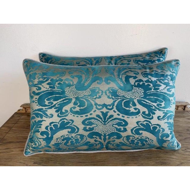 A striking pair of decorative pillows featuring a richly detailed Fortuny-inspired pattern rendered in luminous shades of...