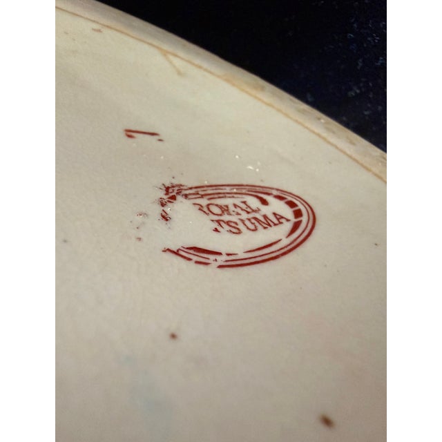 This Japanese Satsuma floor vase is elaborately decorated with intricate hand painted designs, reflecting traditional...