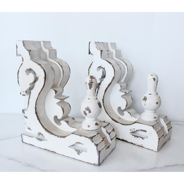 Carved French style distressed corbels. Entirely hand-carved with pretty decorative scrollwork cutouts. We love to...