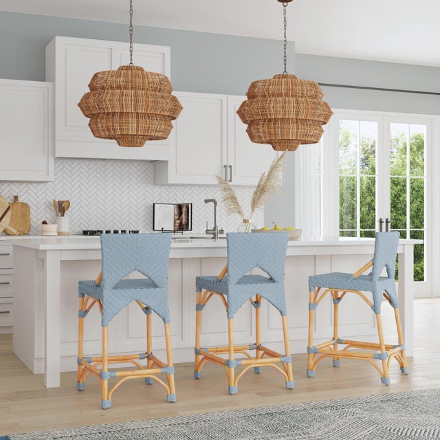 Function, form and fun all come together on this beautiful Butler Specialty Company PU Rattan weave counter stool. The...