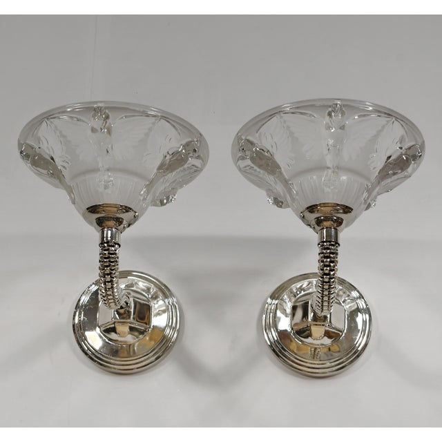 JEAN BORIS LACROIX A beautiful pair of French art deco double wall sconces around 1935-1940 in nickel-plated solid brass...