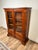 This vintage Victorian‑style bookcase combines refined design with practical storage. With its paneled glass doors and...