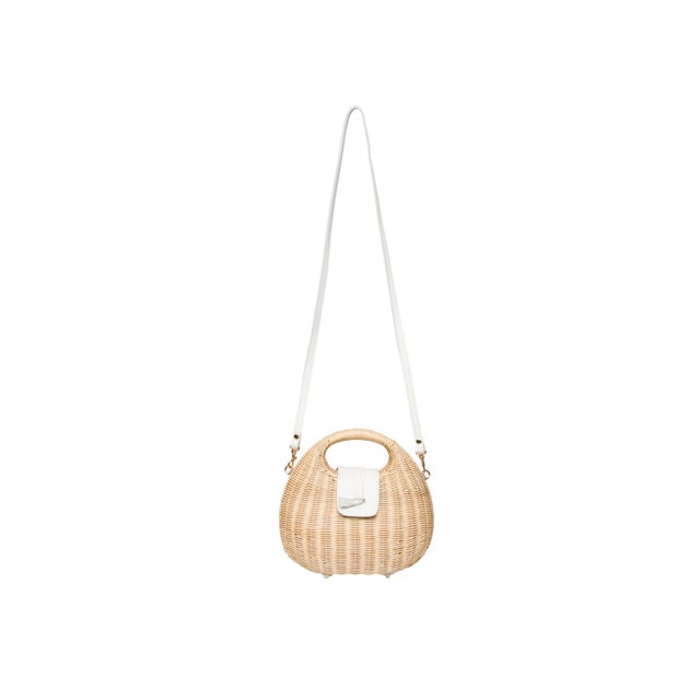 The ISI cut-out handle clutch is the ultimate warm-weather accessory. Expertly handwoven from natural fine wicker, it...