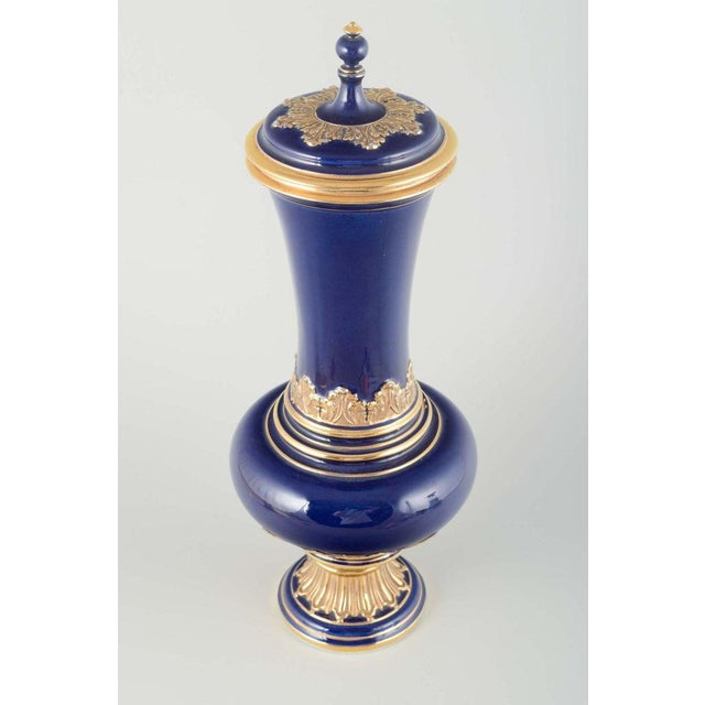 Meissen Lidded porcelain vase, early 20th century. Elegant lidded vase in deep cobalt blue glaze, richly decorated with...