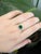 An elegant engagement ring features a dazzling&nbsp;1.28-carat emerald-cut diamond set in a classic 14K yellow gold band....