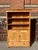 Antique pine bookcases are hard to find so the shell of this piece was provided by a vintage pine armoire. With one board...