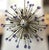 Italian modern Sputnik chandeliers with hand blown lilac and clear Murano glass spheres, mounted on natural brass frames...
