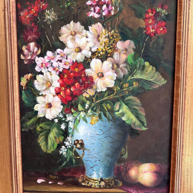 This is a beautiful framed oil painting of a gorgeous arrangement of flowers in an elegant vase. It would be perfect for...