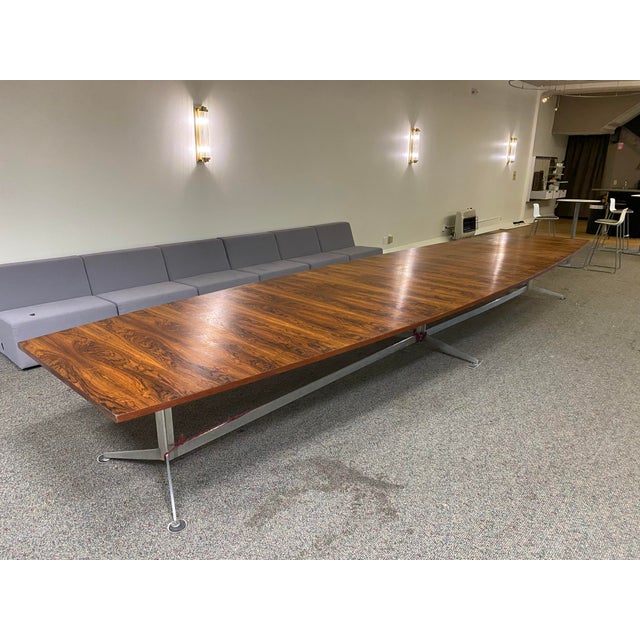 This is a twenty-two foot long exotic endangered rosewood conference table on a steel base. It originally came from a...