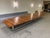 This is a twenty-two foot long exotic endangered rosewood conference table on a steel base. It originally came from a...