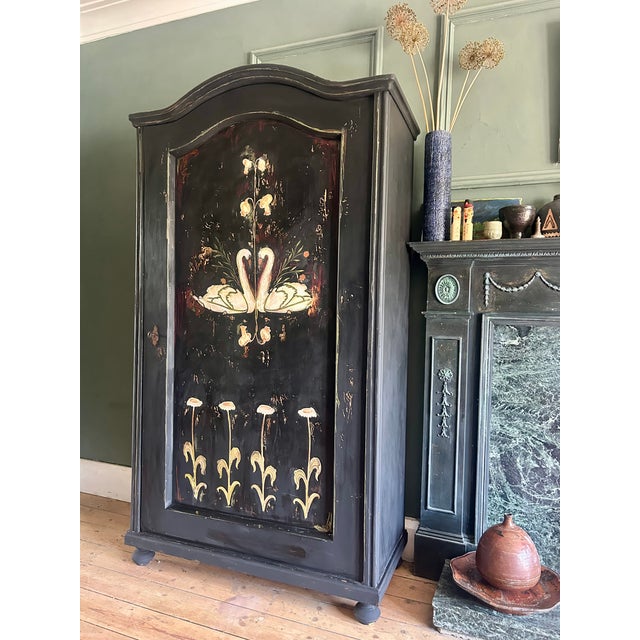 Vintage pine wardrobe, we have added a Folk Art design depicting Swans and daisies. The wardrobe has a wonderful patina....