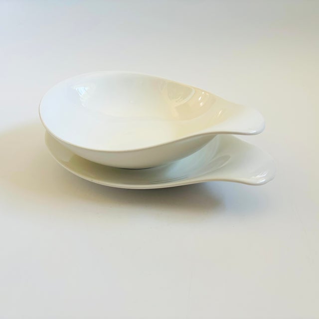 A mid century modern set of 2 large serving dishes. Includes a large lugged bowl and a serving platter. From the...