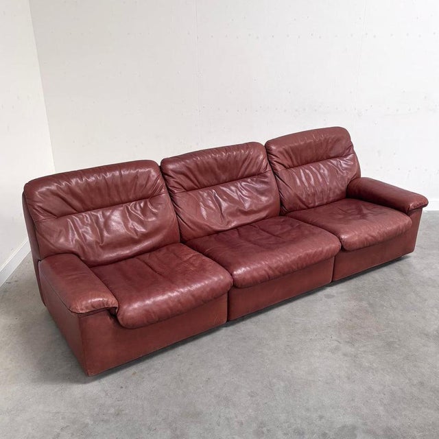 Remarks: Vintage De Sede lounge sofa, model DS 66. Leather upholstery with wooden frame. Leather in great condition with...
