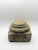 An authentic mid-19th century hand-carved stone architectural plinth featuring a square base supporting a beautifully...