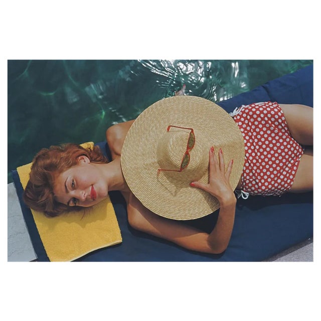 Slim Aarons, Sunbathing in Burgenstock, Estate Stamped Photographic Print, 1955 / 2020s For Sale