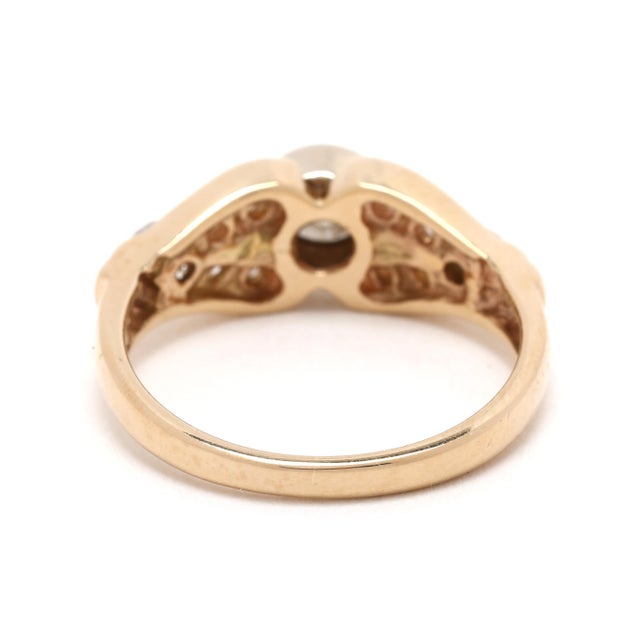 Stones: diamond, 13 round brilliant cut 1.75-4.5 mm .70ctw LB-HI color/ SI1-2 clarity Ring Size 5.5 Rise off of Finger:...