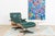 This original Herman Miller Eames Lounge Chair with matching ottoman combines avocado-green leather with expressively...