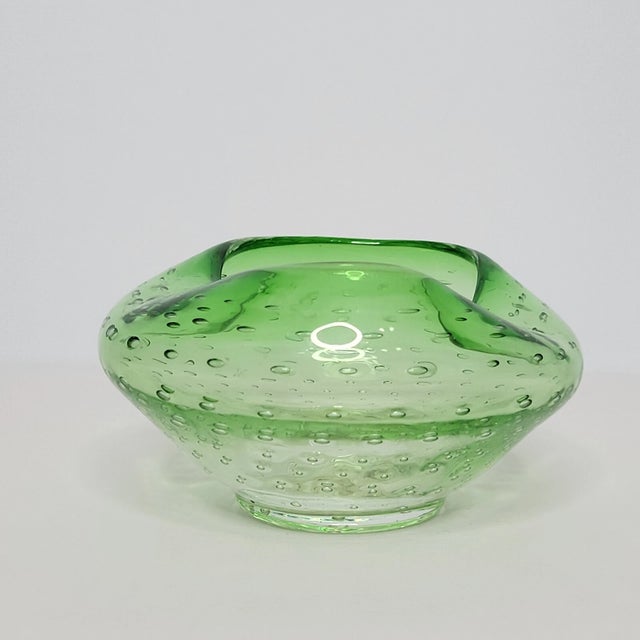Bring timeless Mid-Century Modern elegance to your collection with this beautiful **Vintage Kreiss Art Glass Bowl**....