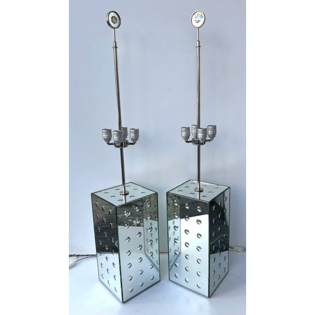 Pair of table or bedside lamps in silver nickeled brass and silver mirror optical Murano glass. Contemporary work from the...