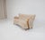 A beautifully sculptural Swedish Modern sofa from the 1930s–40s, newly upholstered in luxurious natural sheepskin. The...