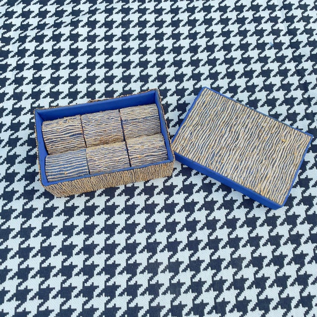 Up for grabs is a set of 6 textile wrapped napkin rings and they’re matching box. The exterior of the napkin rings and the...