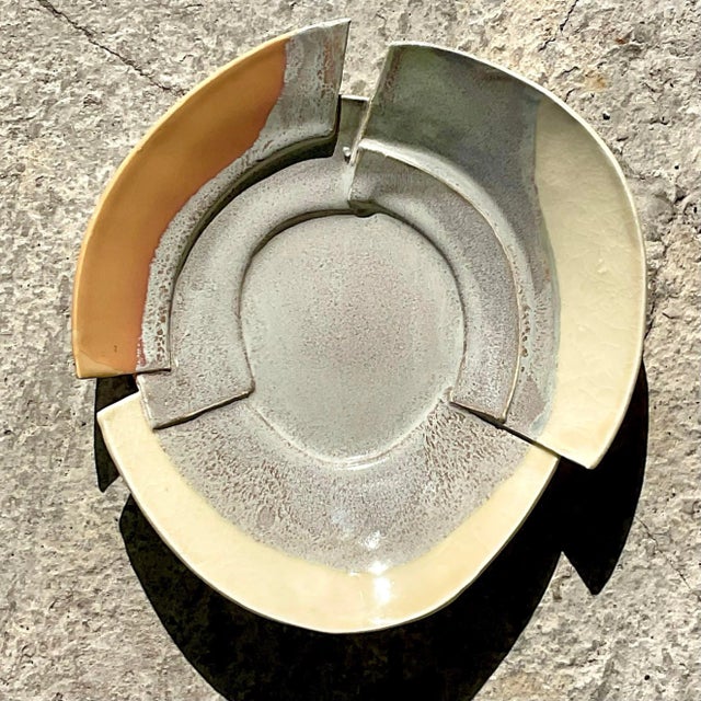 This late 20th-century Boho studio pottery plate features a unique slab-built design that highlights its handcrafted...