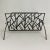Circa 1980s/1990s Brutalist magazine rack Geometric welded iron pattern Can hold books, magazines, or fireplace logs
