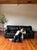 A modern black "draping leather" sofa by Roche Bobois. Mid-Century Modern or Postmodern Italian style. Characterized by...