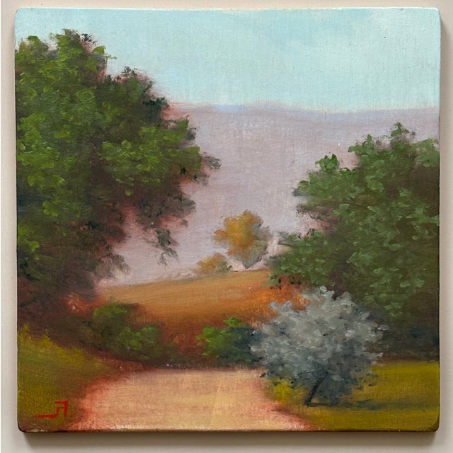 A landscape painting from the earlier years of Fabrizio Ferrari, an Italian artist. A heavenly plain air painting on wood.