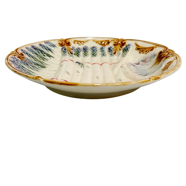 An authentic late 19th-century French barbotine (majolica) asparagus plate, sourced in Paris. Made by the Faïencerie...