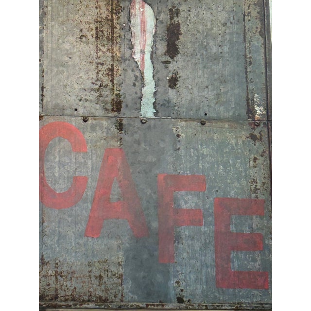 Super cool galvanized metal fragment from a retro neon sign with hand painted red “Cafe” on it. Clever artisan Nick Benton...