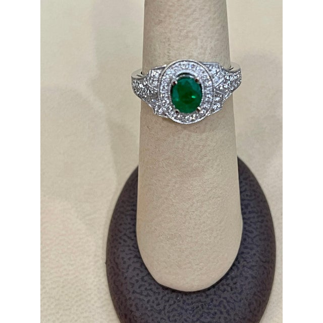 Traditional 0.80 Carat Oval Cut Emerald and 0.85 Carat Diamond Ring 18 Karat White Gold For Sale - Image 3 of 18