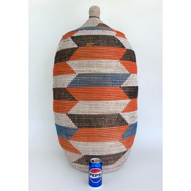 Large Senegalese Hand-Woven Basket/Hamper with Top Offered for sale is a large and colorful geometrically designed hand...