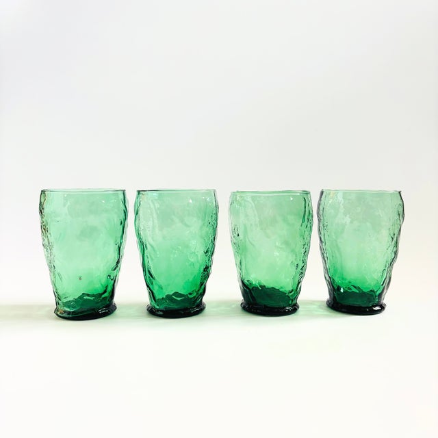 A set of 4 mid century green crinkle glass tumblers. Each glass has a great organic shape. Made in Italy. 2 sets of 4 are...